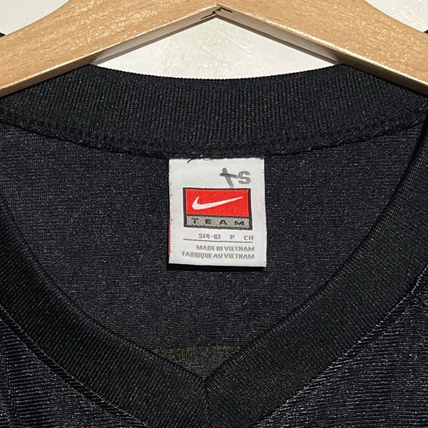 Black football jersey collar with a Nike label on a hanger