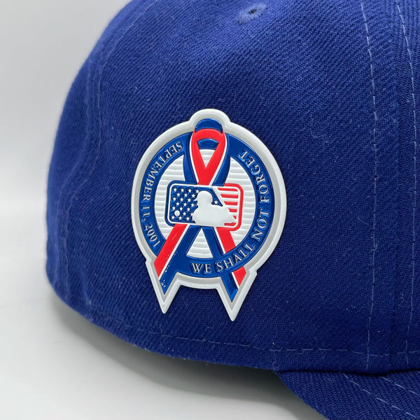 9-11 side patch on a blue Dodgers cap