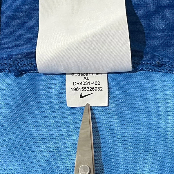 Nike product code label in a blue soccer jersey