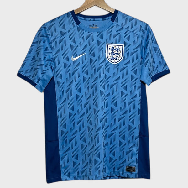 Blue soccer jersey with Nike logo and England flag on a white background