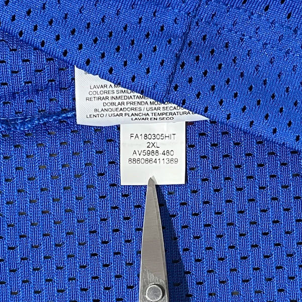 Blue fabric with a white Nike product code label