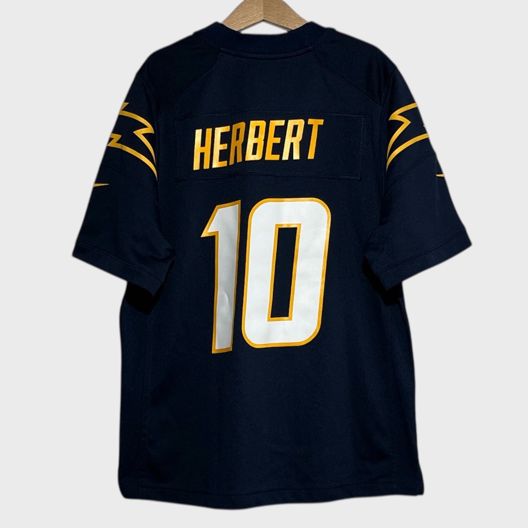 Navy blue football jersey with 'HERBERT' and number '10' on a white background