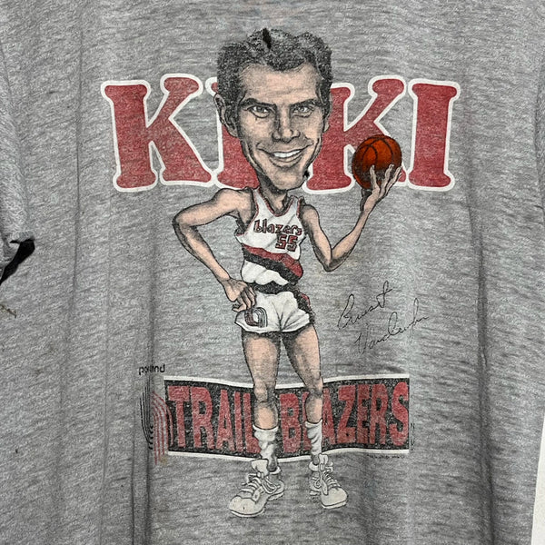 Gray t-shirt with a caricature of a basketball player and 'KIKI Trail Blazers' text.