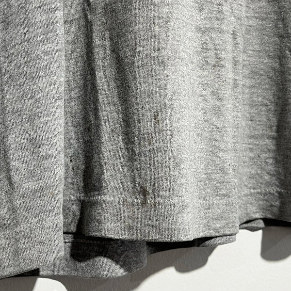 Close-up of a gray textured fabric with soiling.