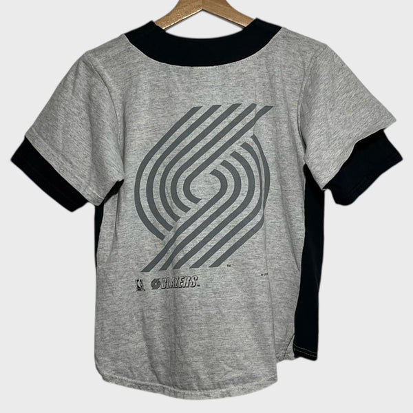 Gray baseball jersey with black accents and a pinwheel logo on a hanger against a white background