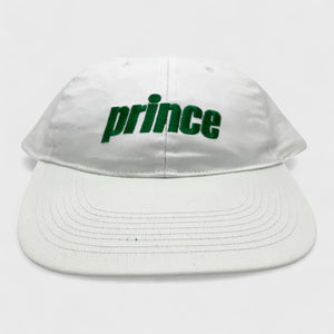 White cap with 'prince' in green on a white background