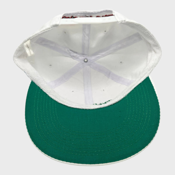 Green cap with white interior on a light gray background