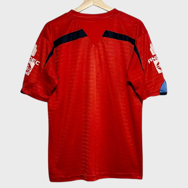 Red soccer jersey with black accents on a white background