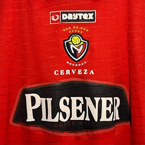 Red soccer jersey with Daytex and Pilsener branding