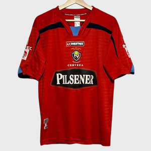 Red soccer jersey with visible branding on a white background