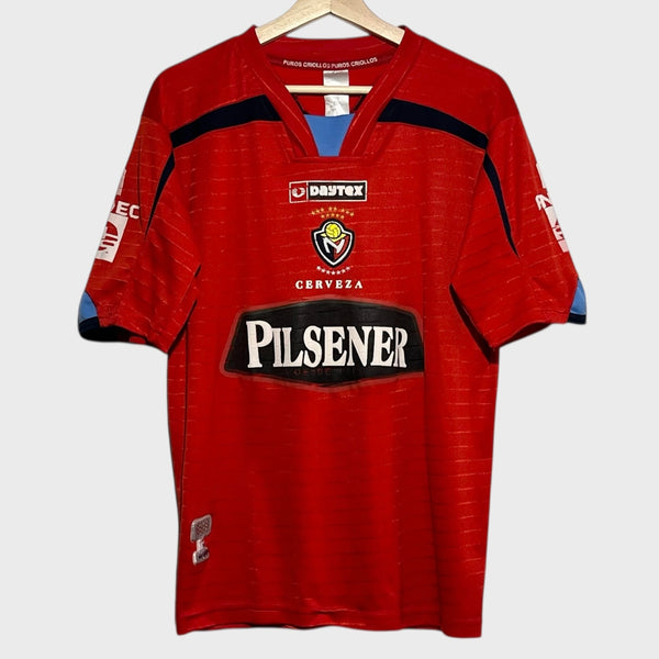 Red soccer jersey with visible branding on a white background