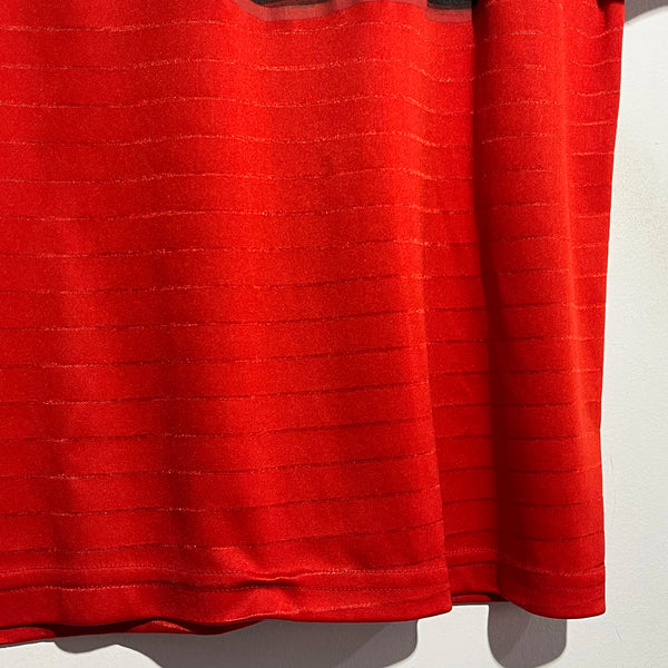 Close-up of a red textured fabric on a white background