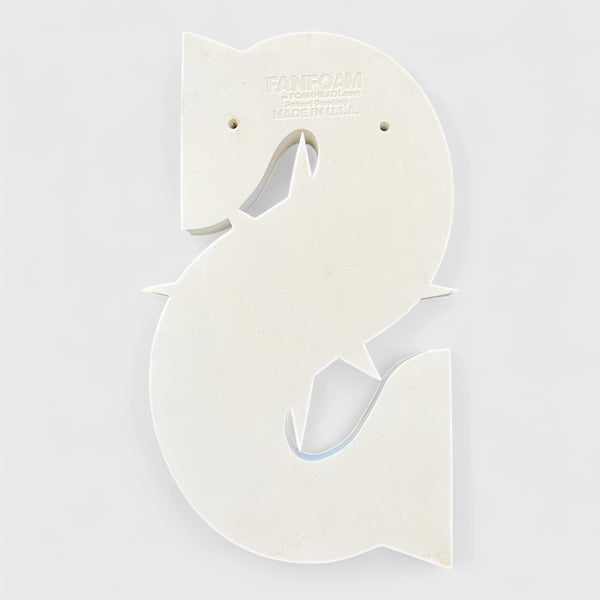 Bottom of a Seattle Mariners shaped white foam block on a light gray background