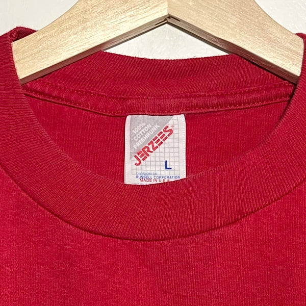 Red t-shirt collar with a Jerzees label on a hanger