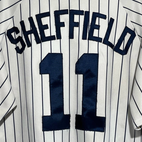 Baseball jersey with 'Sheffield' and number '11' on a white and black striped background