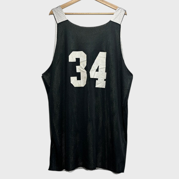 Back of a black basketball jersey with number 34 on a hanger against a white background