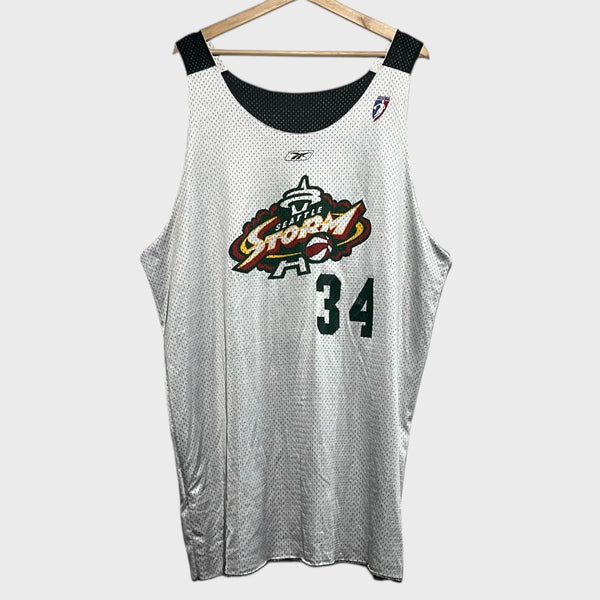 White basketball jersey with Seattle Storm logo and number 34 on a hanger against a white background