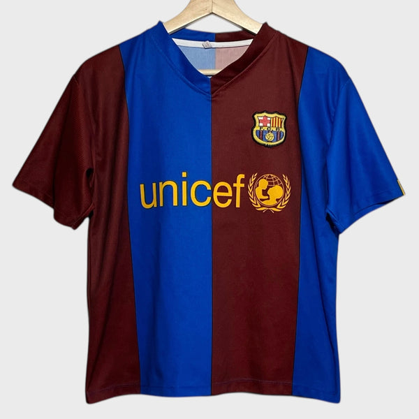 Blue and red striped soccer jersey with Unicef logo on a white background
